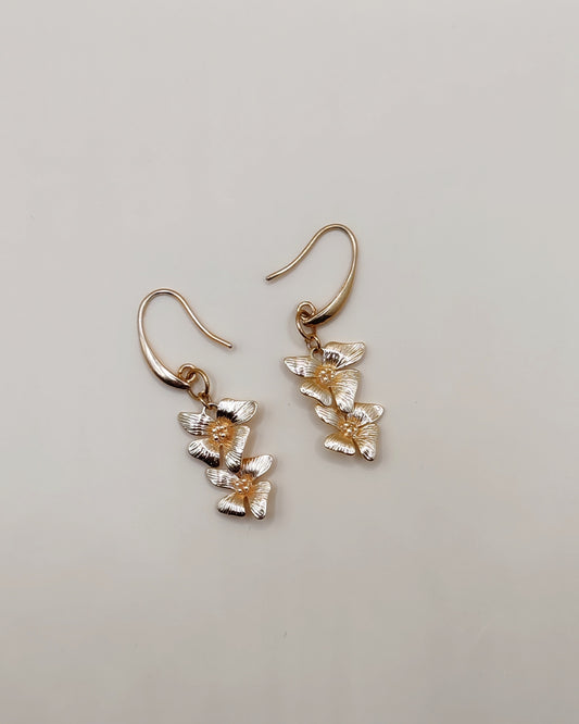 Aretes Flor Doble Elegancia Natural – Chapa de Oro 14K